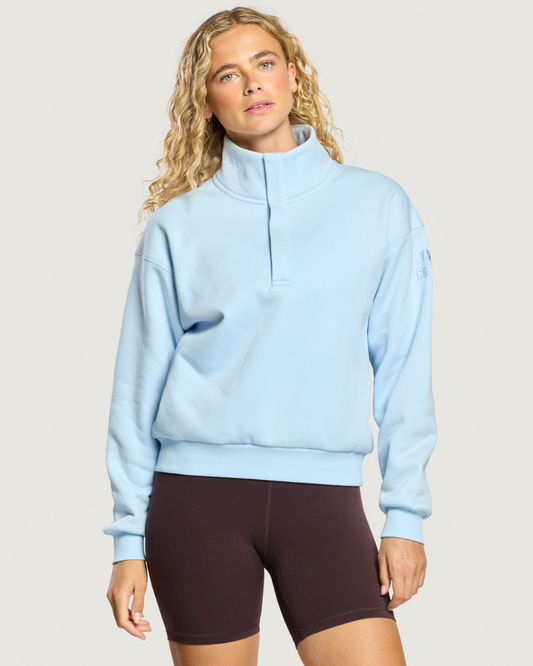 Woman wearing Gym+Coffee Daily Snap Collar Sierra Sweatshirt Glacial Blue Shop Gym+Coffee at Dotique