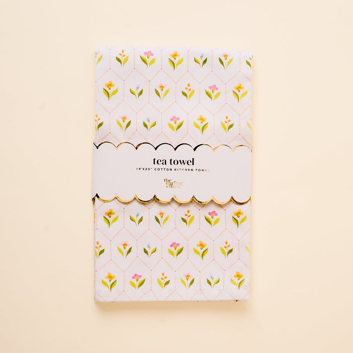 The-darling-effect’s Handpicked For You Tea Towel features a folded cotton design with a yellow, pink, and green floral pattern, wrapped in a scalloped “tea towel” label—an ideal kitchen accent.