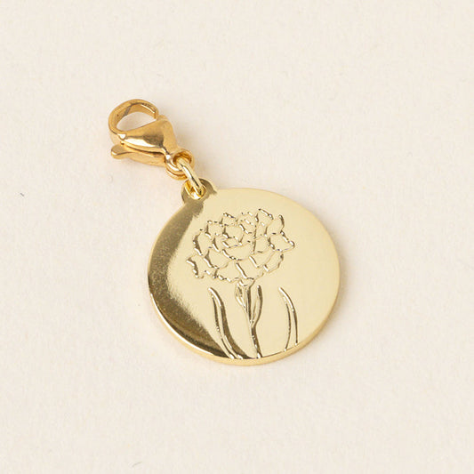 The January Jewelry Birth Flower Charm Gold by the-darling-effect features a round gold charm with a clasp, engraved with a line art flower and leaves—an elegant personalized accessory, showcased on a plain light background.